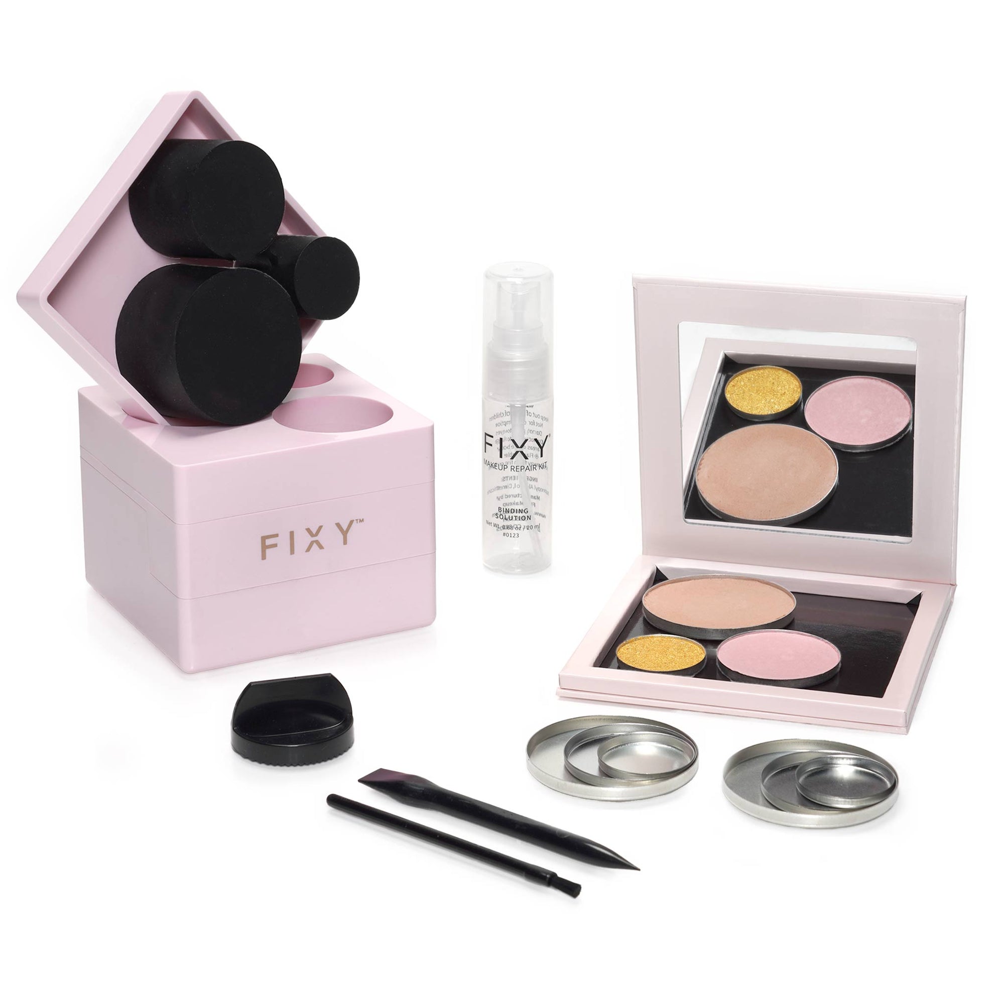 FIXY Makeup Repressing Kit displayed with circle pans, binder spray, grinder, makeup press, and removal tools for repairing broken makeup and depotting, including 10 empty circle makeup tins.