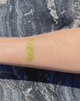 Gold biodegradable loose glitter on skin